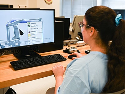 UTC student, Musa, working with AI
