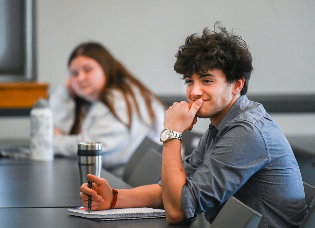 Students confer during Alycia Franklin’s Consumer Behavior class Monday, Jan. 23, 2023 in Fletcher Hall.