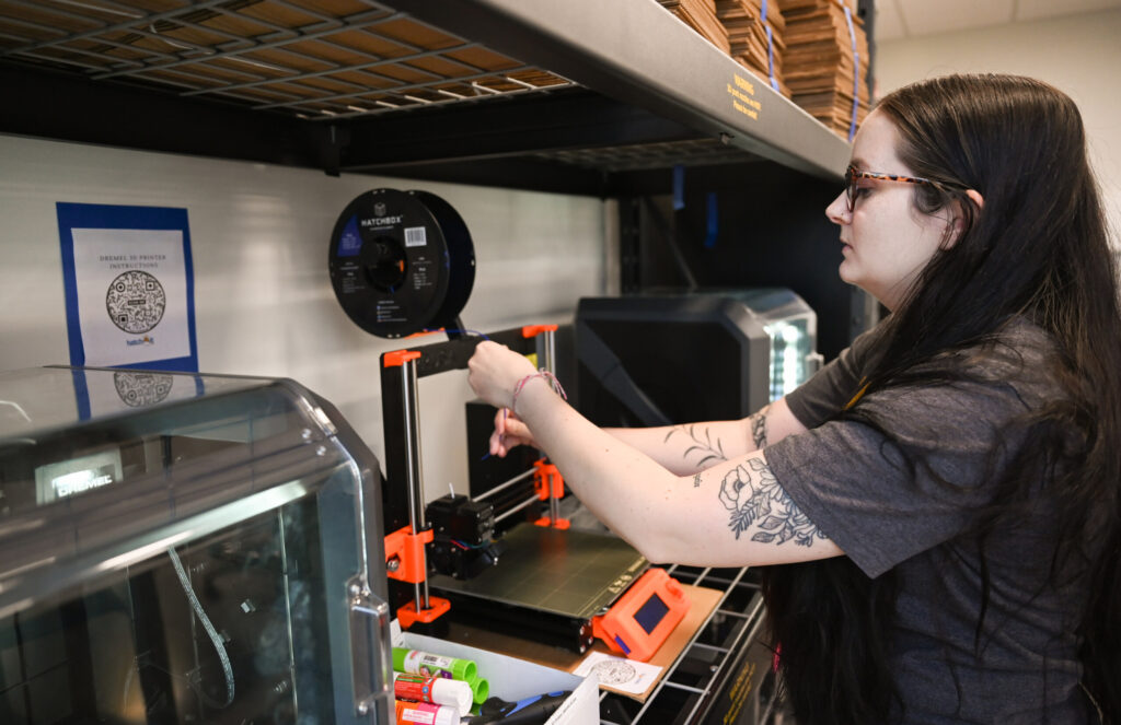 Sami Belcher, Maker Space manager, works Wednesday, May 18, 2022 in the Mapp Building.