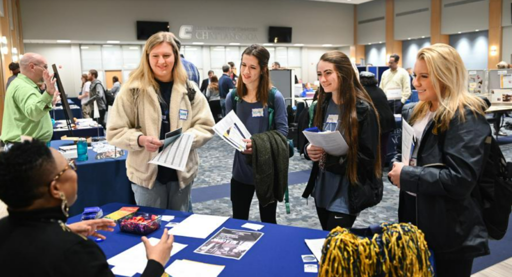 Students at a sign-in table at First Flight