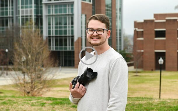 During his time as a UTC student, Jerrod Niles, seen here standing in front of the UTC Library, chose the work of artist Amanda Brazier for his multimedia project, “The Field Below.”
