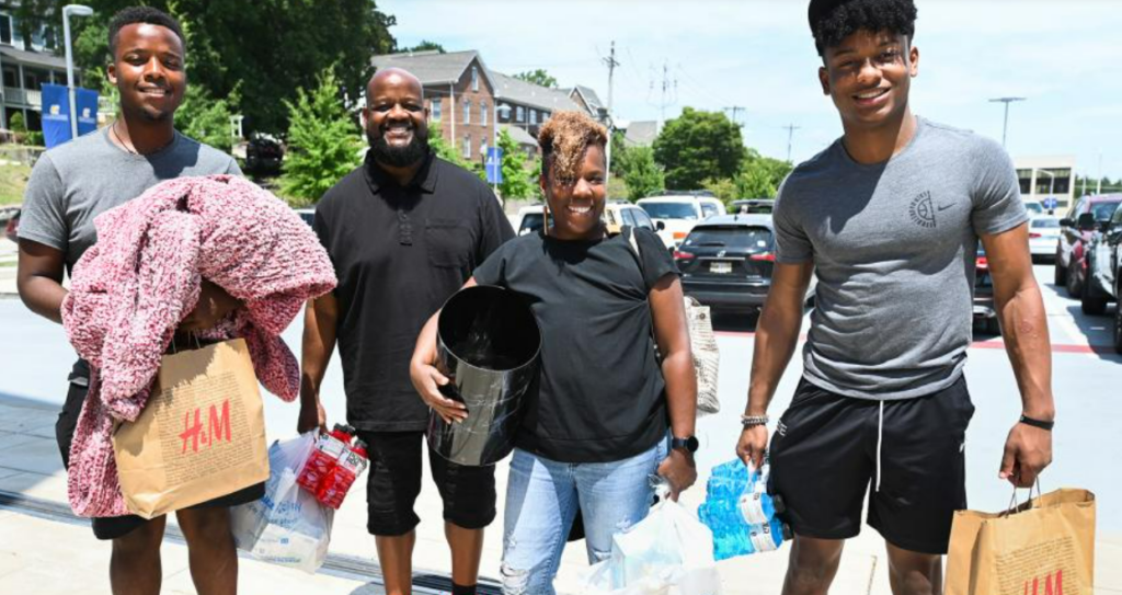 A family helps move their son into a UTC residence hall