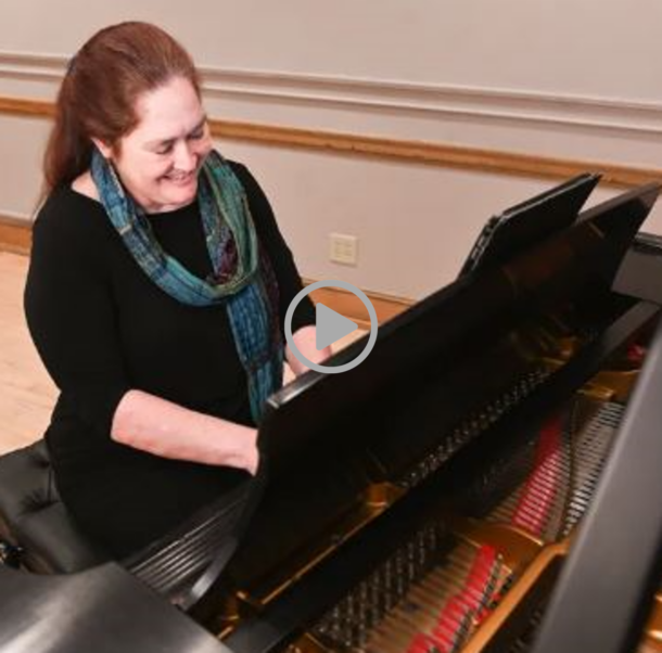 Martha Summa-Chadwick sitting at a piano