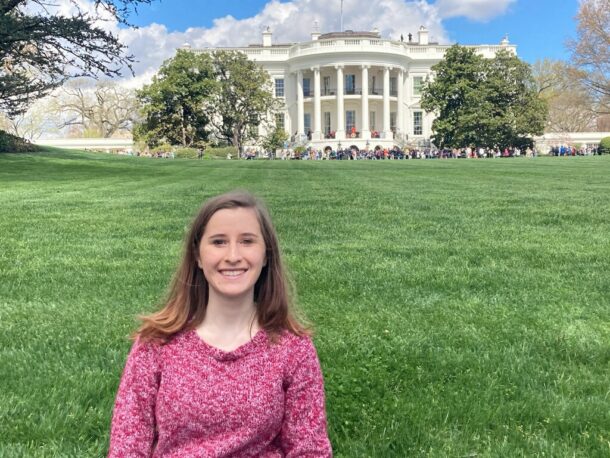 Fall '21 UTC grad Nicki Messer, standing in front of the White House, is now a congressional staff assistant in Washington, D.C.