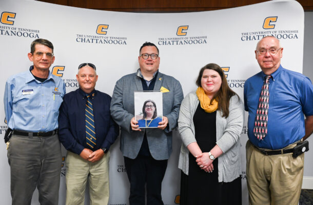 Blue Ribbon Award winners John Johnson, Leslie Ellis, Jason Harville, holding photo of winner Nora Ketron, Tish Hubbard and Bill Floyd, from left, are honored Tuesday, Aug. 30, 2022 during a luncheon in the University Center.
