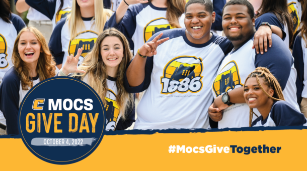 Orientation leaders promoting Mocs Give Day