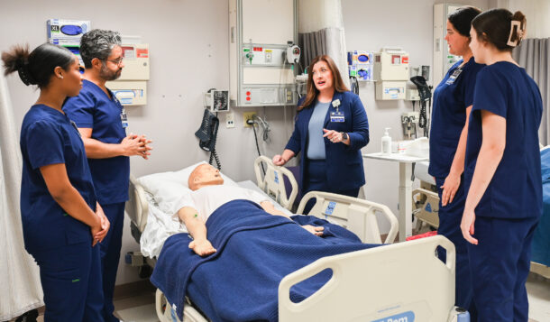 Dr. Brooke Epperson, center, talks with UTC nursing students Mia Robinson, Dean Zeitouni, Katelyn Nash and Abby Walsh in the nursing lab.