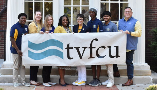 TVFCU’s Dionne Jenkins (yellow sweater), UTC staff and MOC Academy students recognizing TVFCU’s $10,000 gift to MOC Academy on Mocs Give Day.