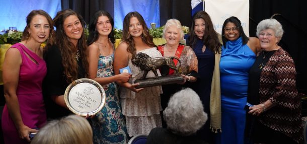 UTC students Abbe Burden (third from left) and Meredith McNeeley with the Golden Lion, along with alums (from left) Rikki Heard,, Stephanie Blaine, Beth Gentry Mannle, Mandy Holland Savage, Kacie Sherrell and Fran Bryan. Photo courtesy of Stephanie Blaine.