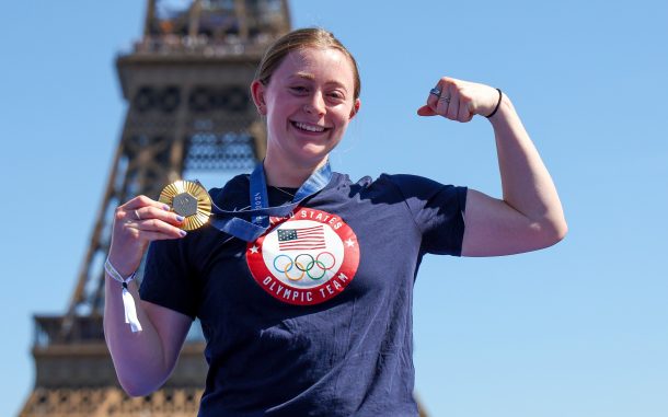 Olivia Reeves with her gold medal in front of the Eiffel Tower. Photo courtesy of Getty Images.