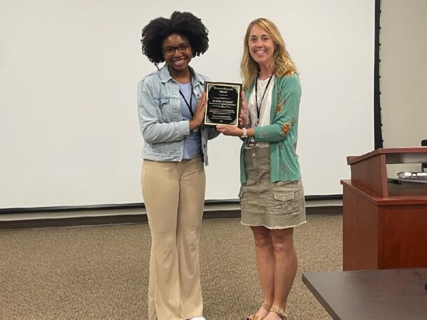 Alicea Wilson (left) and Tennessee Association of School Psychologists President Pam Haggard pose with the William Ballard Award. Photo courtesy of Amanda Hardin.