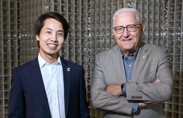 Dr. Tian Li, UTC assistant professor of physics and chief technology officer for the Quantum Center, left, and Vice Chancellor for Research Reinhold Mann.