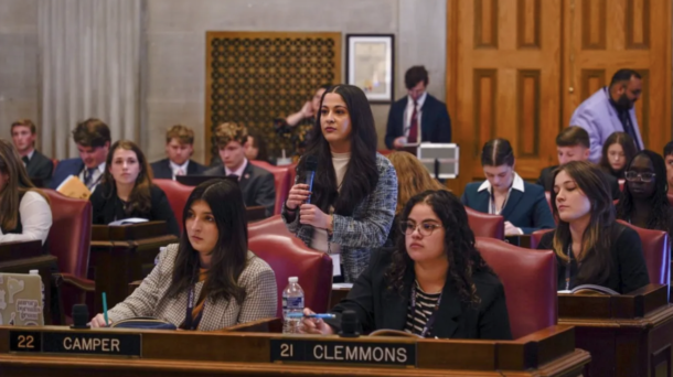 Beeta Baghaevaji (standing) defended her bills at the TISL mock legislature. Photo courtesy of Susanne Cooper.