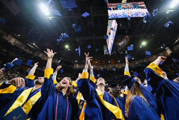 Students toss their caps at the end of the first of two undergraduate ceremonies Saturday, May 3, 2025 in McKenzie Arena at the University of Tennessee at Chattanooga.