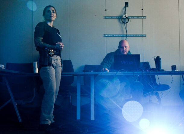 Officer Ellen Centers (left) and Dr. Rick Dierenfeldt demonstrate the VirTra training simulation in a 540 McCallie Building classroom.