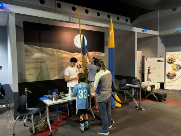 Members of the UTC Rocket Mocs team meet with STEAMagination Festival attendees.