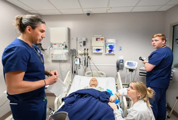 UTC nursing students practice clinical skills using a mannequin during a simulation exercise in the School of Nursing.