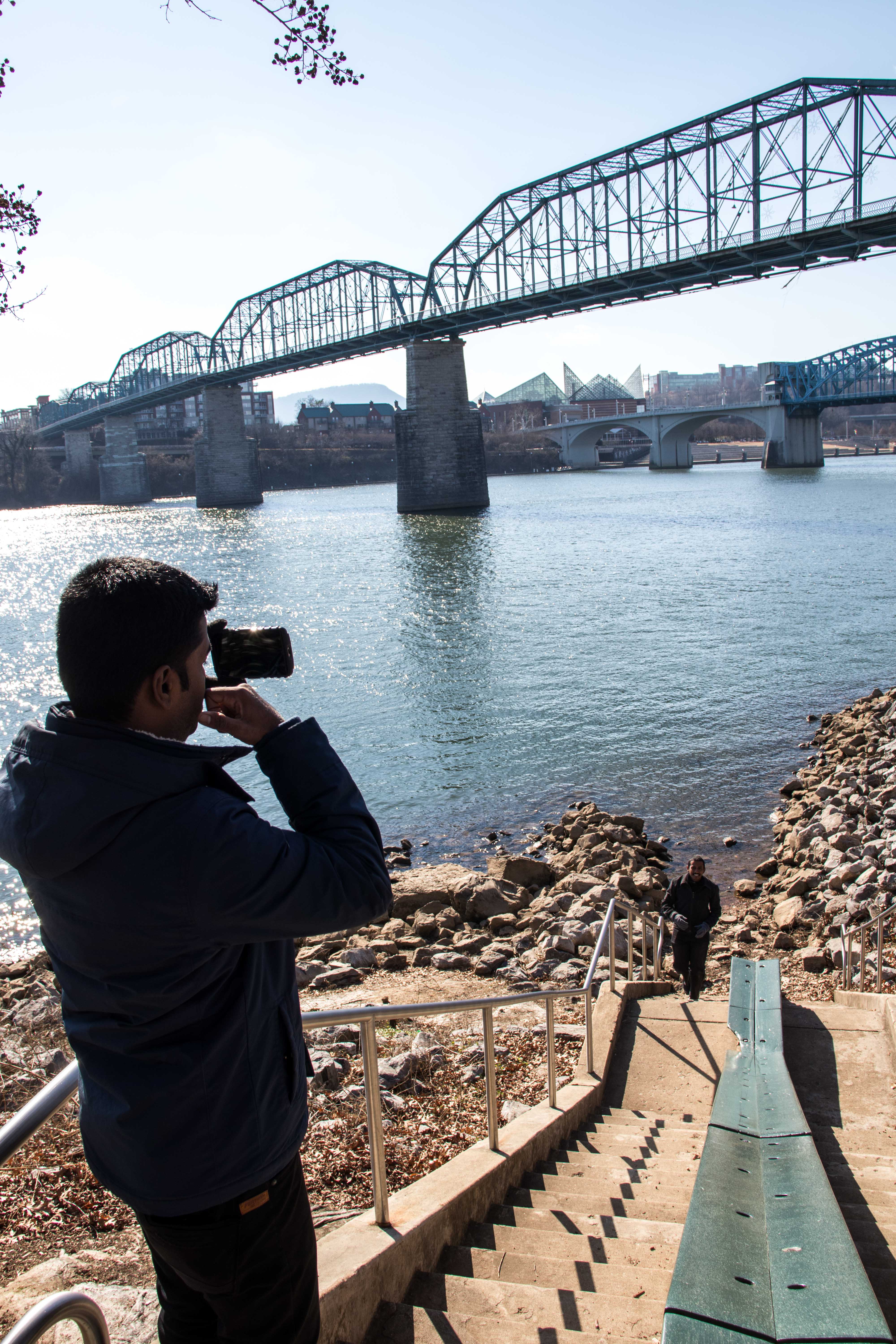 International students take in the beautiful Tennessee river and Walnut St Bridge