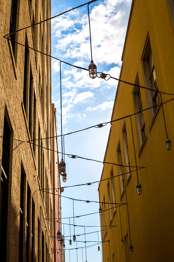 Alley way in downtown Chattanooga decorated with hanging lights.