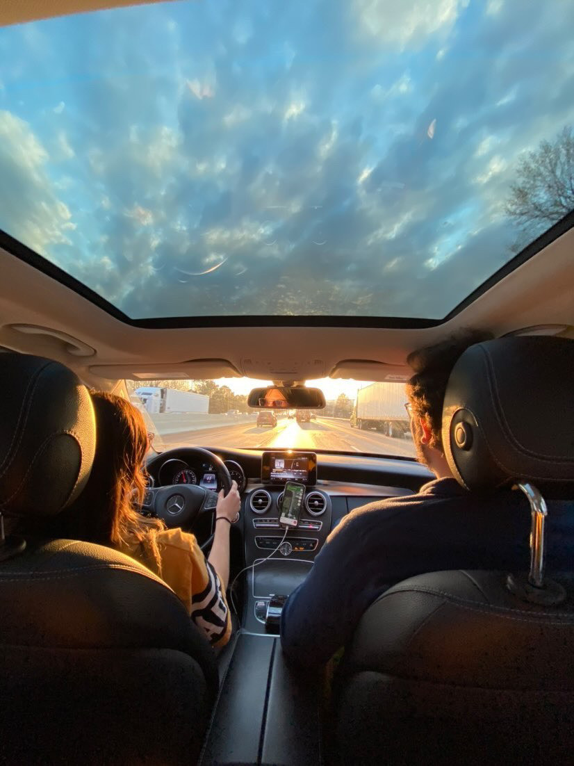 a group of students riding in a car