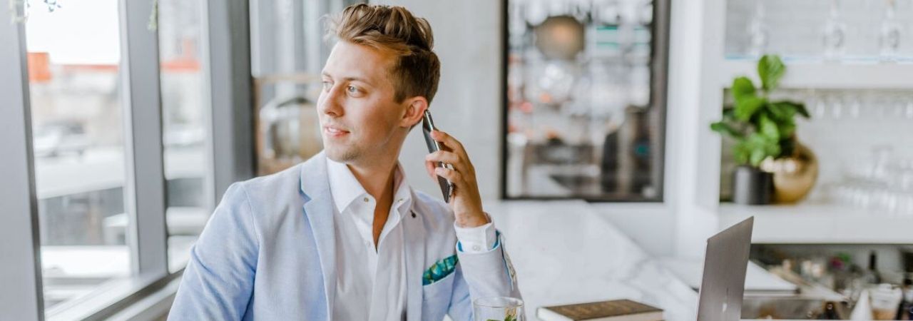 man talking on the phone and looking off to the side