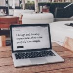 laptop with description of web design showing