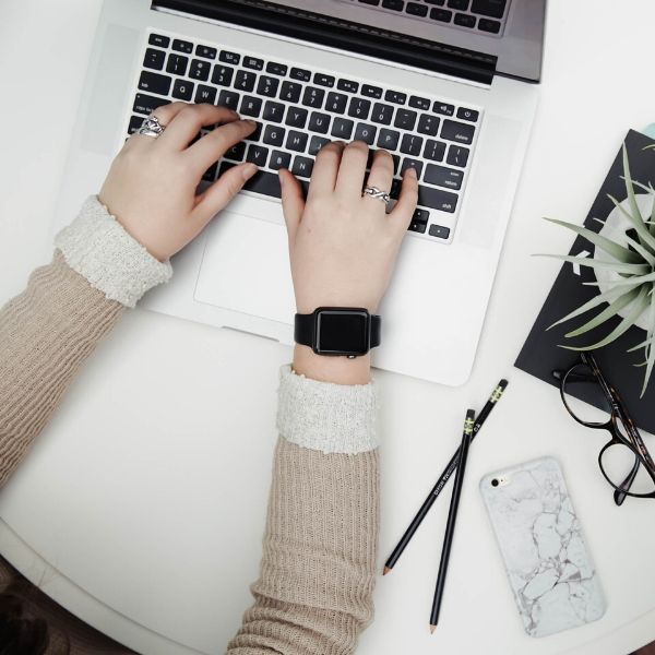 woman typing on a laptop