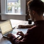 man working on laptop from home office