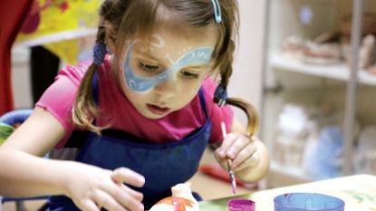 a young girl painting