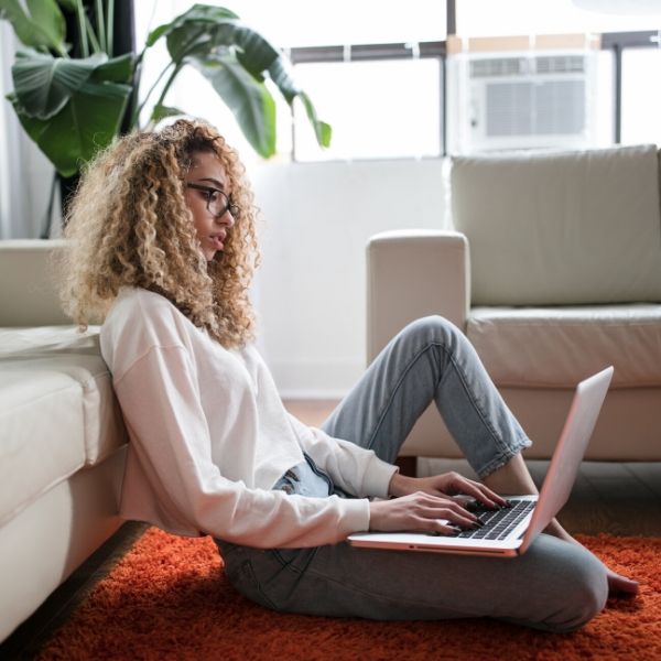 woman working on a laptop in her home
