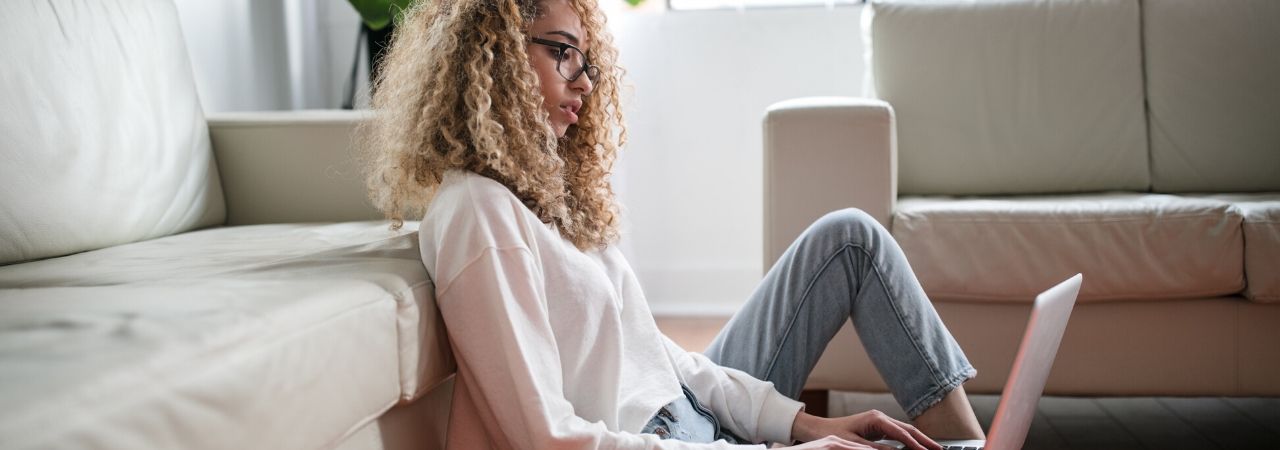 woman working on a laptop in her home