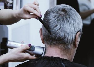 older gentleman getting a haircut