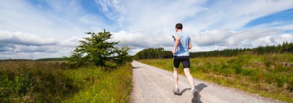 man running in open field
