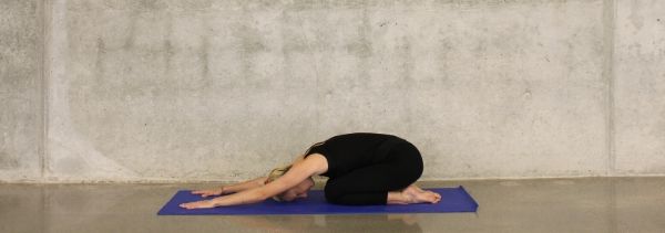 woman striking a yoga pose
