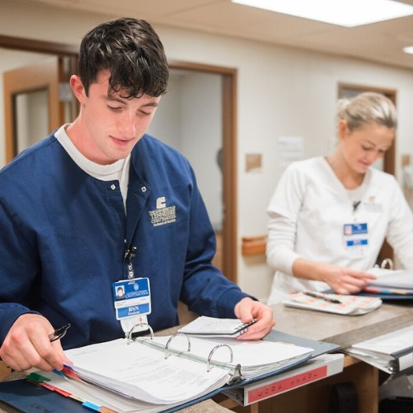 male and female nursing students working at a hospital