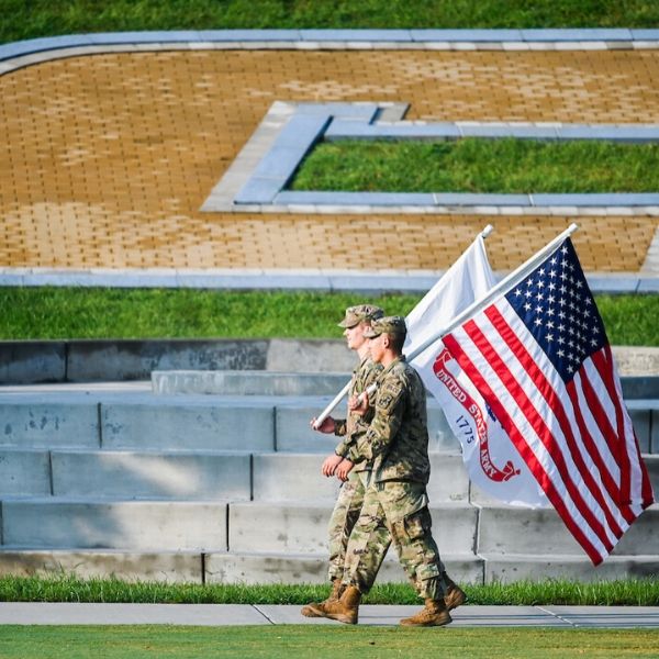 two soldiers carrying flags