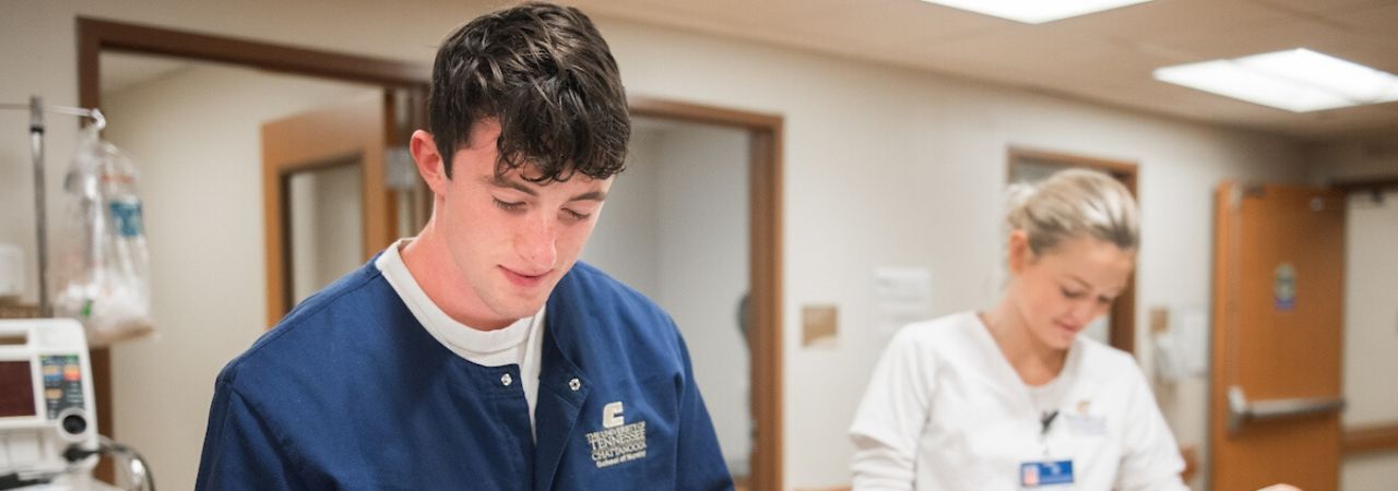 male and female nursing students working at a hospital