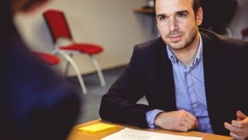 male paralegal talking to a client