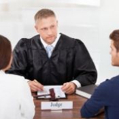 a judge meeting with a young couple