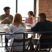 a man leading a conversation with his coworkers