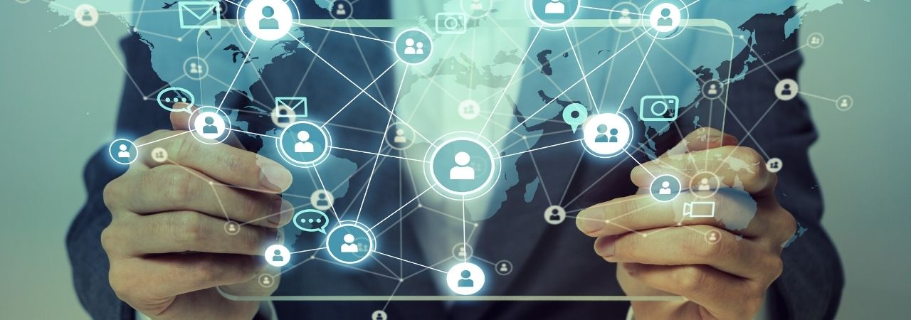 a man holding a silhoutted tablet with a mixed media social networking concept design on it