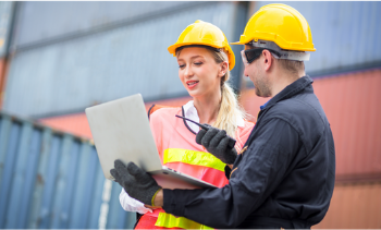 female and male supply chain workers working together