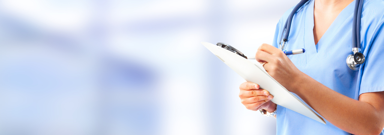 nurse writing on a clipboard