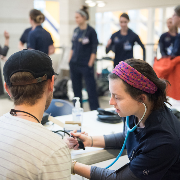 nurse taking blood pressure