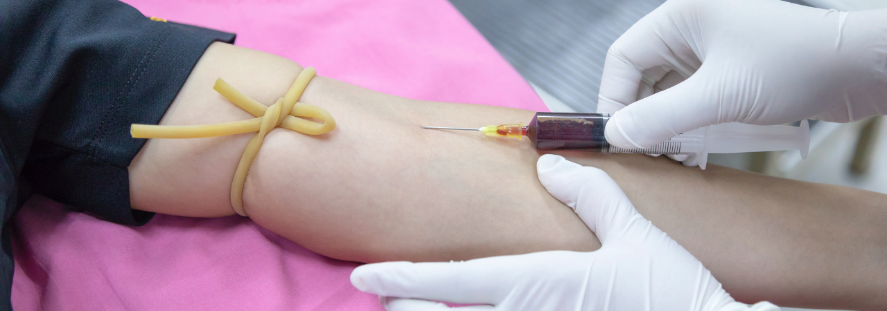 phlebotomist collecting blood