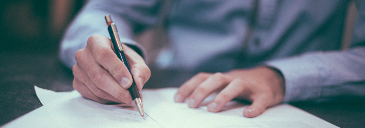 male filling out paperwork