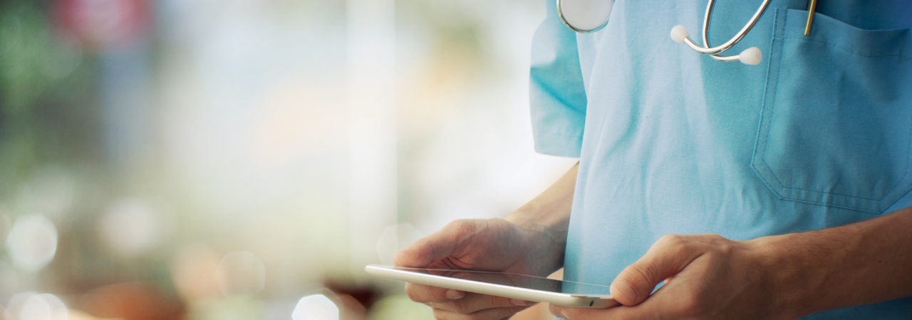 nurse holding an iPad