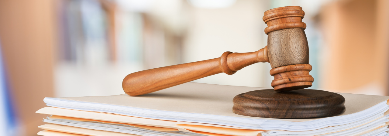 gavel on stack of papers