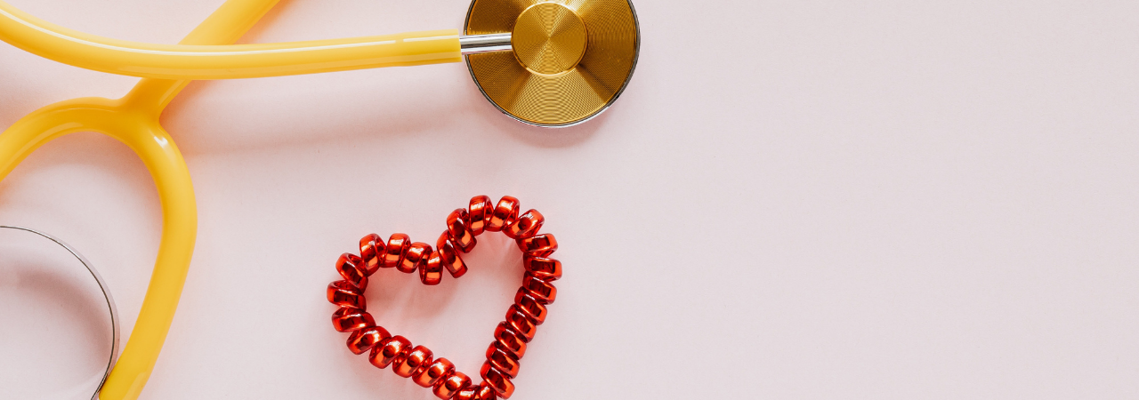 yellow stethoscope with heart beside it