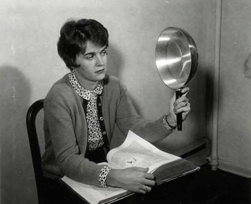 woman looking at skillet